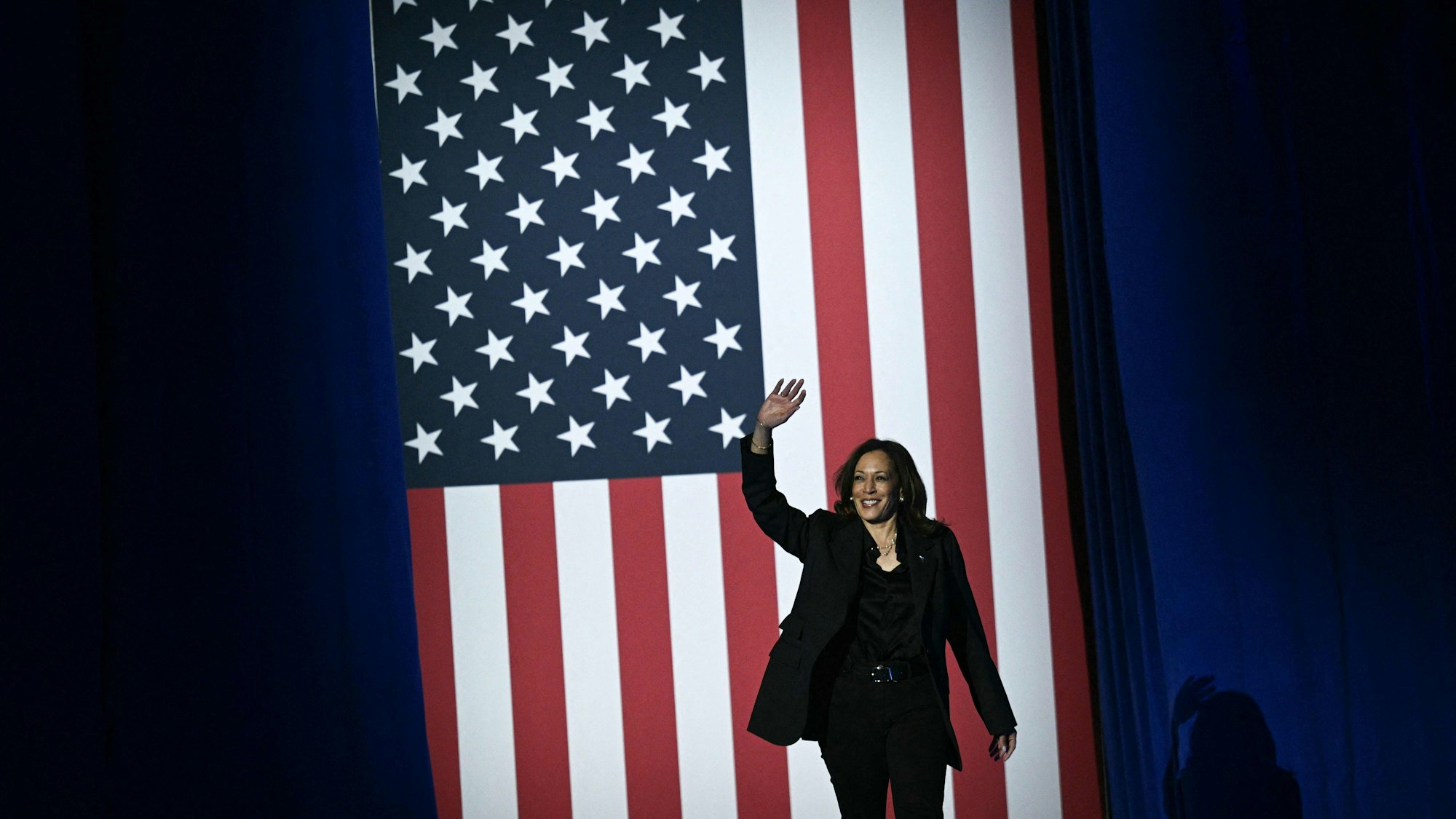 TOPSHOT - US Vice President and Democratic presidential candidate Kamala Harris waves as she arrives to speak during a "When We Vote We Win" rally at the Wisconsin State Fair Park Exposition Center in West Allis, Milwaukee, Wisconsin, November 1, 2024. (Photo by Brendan SMIALOWSKI / AFP)