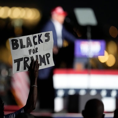 FILE - A supporter holds up a sign as Republican presidential candidate former President Donald Trump speaks at a campaign rally at Trump National Doral Miami, July 9, 2024, in Doral, Fla. (AP Photo/Rebecca Blackwell, File)