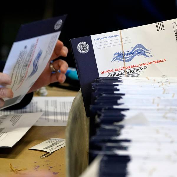 FILE - Chester County, Pa., election workers process mail-in and absentee ballots, in West Chester, Pa., Nov. 4, 2020. (AP Photo/Matt Slocum, File)