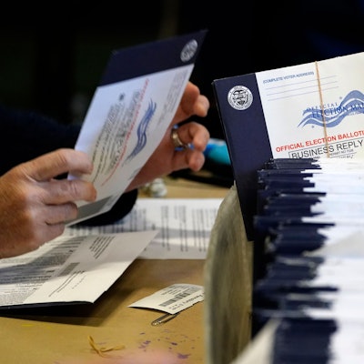 FILE - Chester County, Pa., election workers process mail-in and absentee ballots, in West Chester, Pa., Nov. 4, 2020. (AP Photo/Matt Slocum, File)