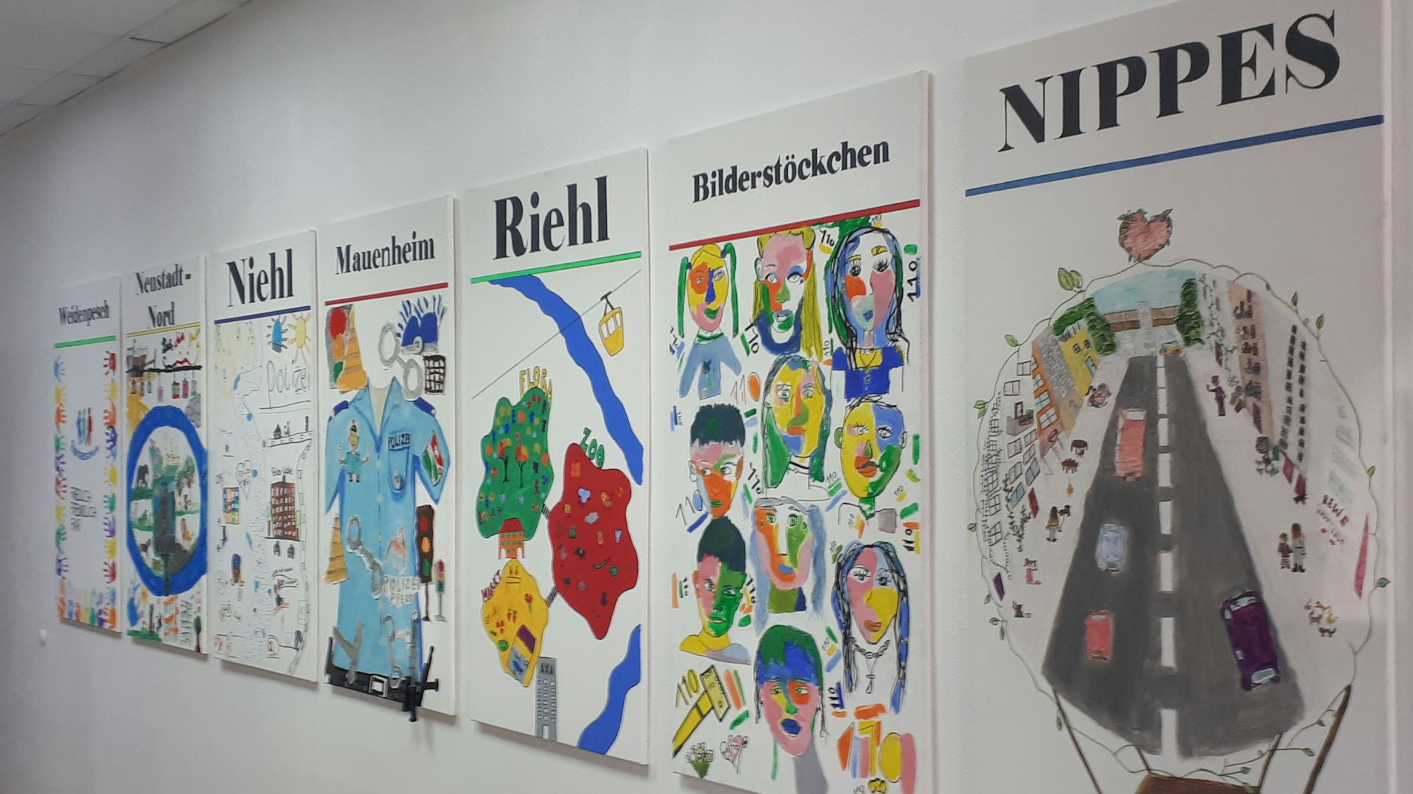 Blick in die Motive der Grundschulen der Kunstreihe „7 Veedel – Ein Wachbereich“.