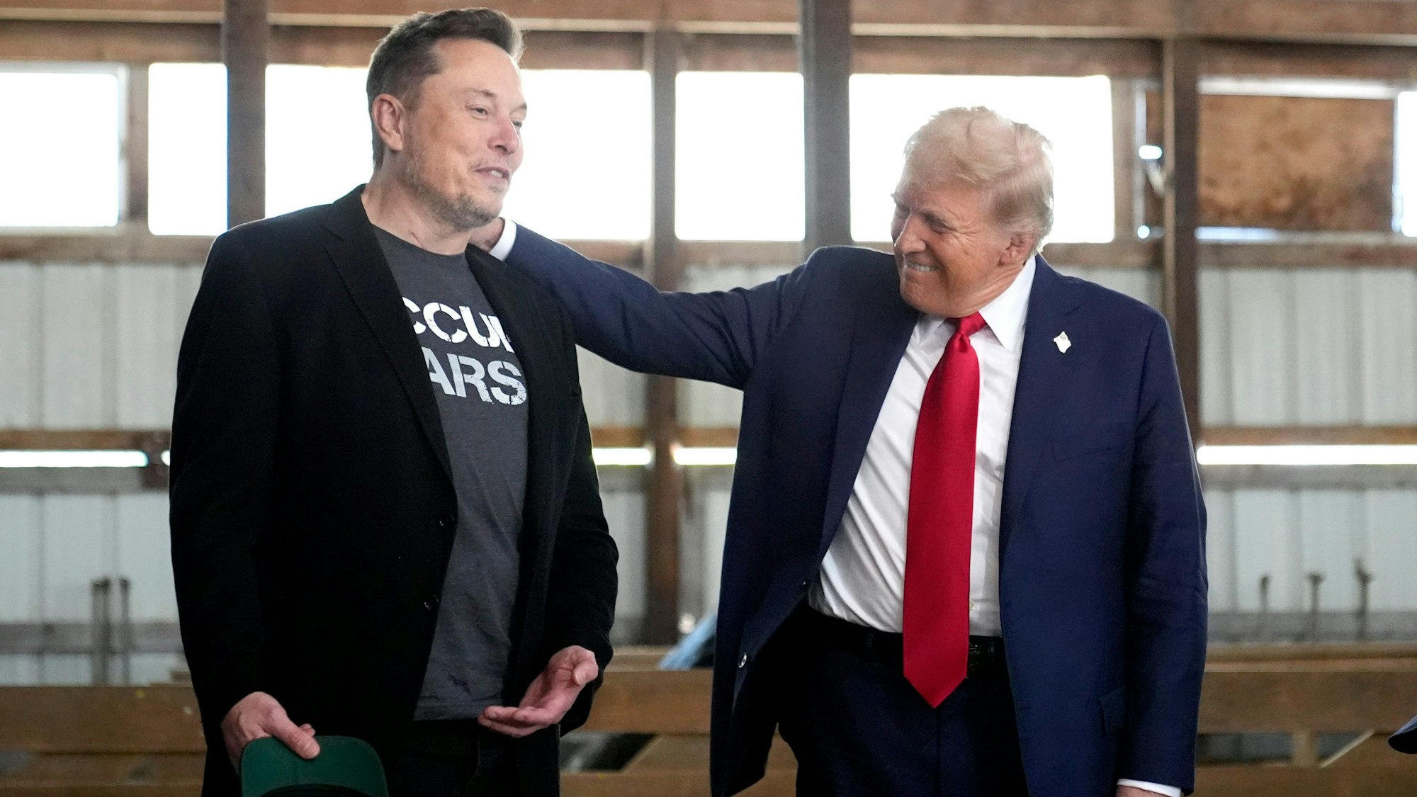 FILE - Tesla and SpaceX CEO Elon Musk, left, and Republican presidential nominee former President Donald Trump attend a campaign event at the Butler Farm Show on Oct. 5, 2024, in Butler, Pa. (AP Photo/Alex Brandon, File)