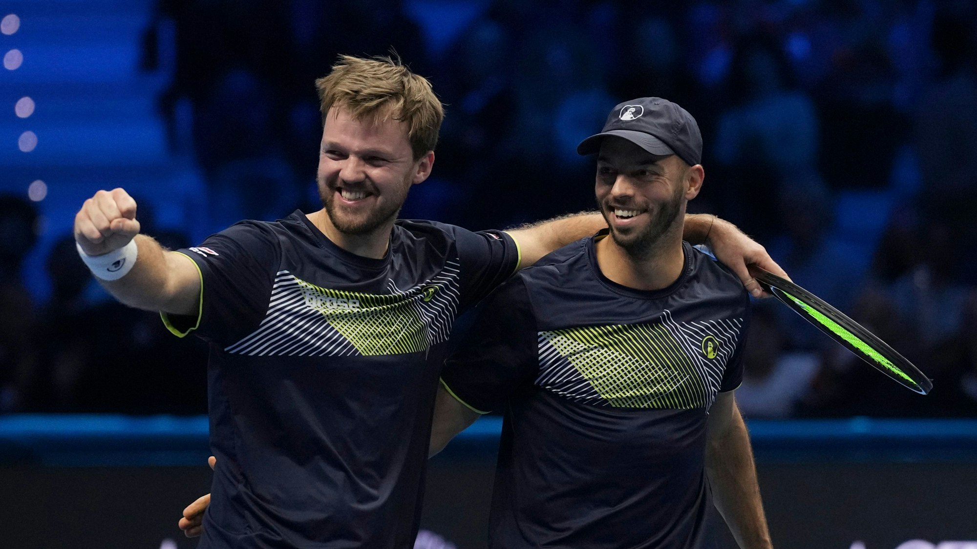 Germany's Kevin Krawietz, left, and Tim Puetz celebrate after winning the doubles final match of the ATP World Tour Finals at the Inalpi Arena in Turin, Italy, Sunday, Nov. 17, 2024. (AP Photo/Antonio Calanni)
