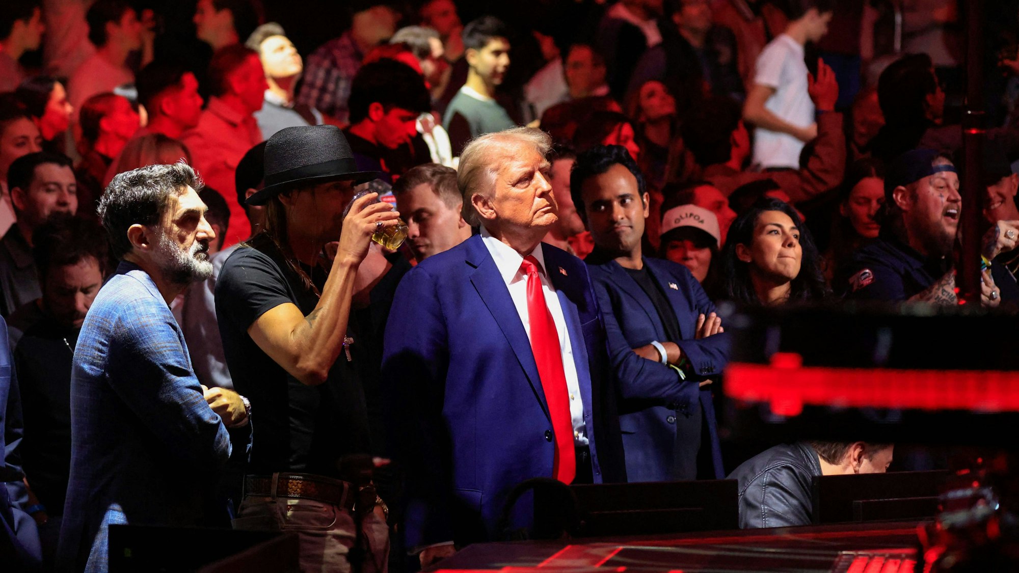 US President-elect Donald Trump, singer Kid Rock and US entrepreneur Vivek Ramaswa stand up after UFC Heavyweight Champion Jon Jones' TKO victory against challenger Stipe Miocic in the UFC 309 heavyweight title bout at Madison Square Garden in New York, on November 16, 2024. US President-elect Donald Trump was greeted by chanting fans as he attended the Ultimate Fighting Championship heavyweight bout at New York's Madison Square Garden on November 16.
Trump entered the arena shortly before the start of the main card accompanied by UFC chief executive Dana White, who was a prominent backer during his election campaign.
Several political allies of Trump were also in attendance including entrepreneurs Elon Musk and Vivek Ramaswamy, who have been asked by Trump to lead efforts to cut government inefficiency. (Photo by Kena Betancur / AFP)