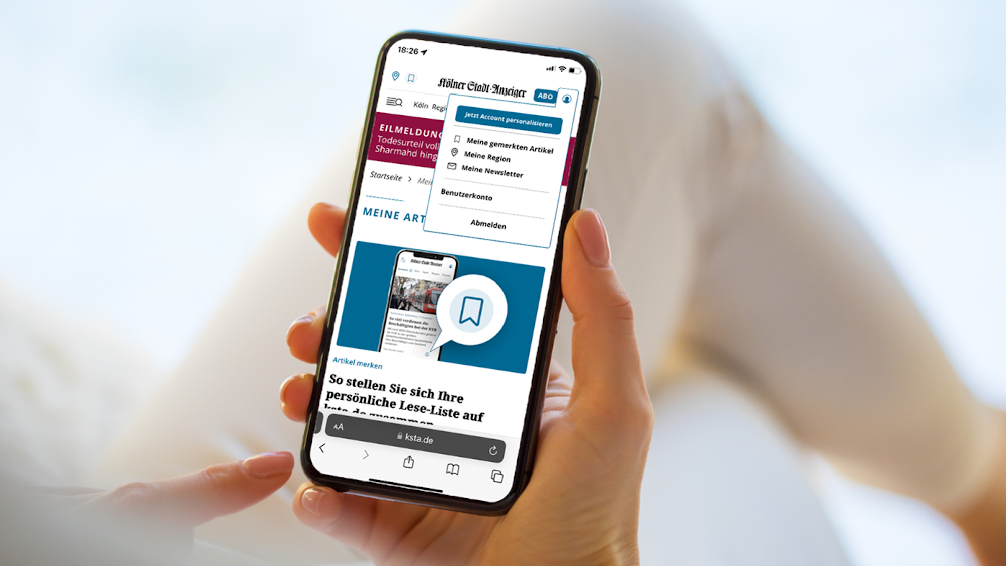 Ein Smartphone-Display zeigt die Bookmark-Funktion auf ksta.de.