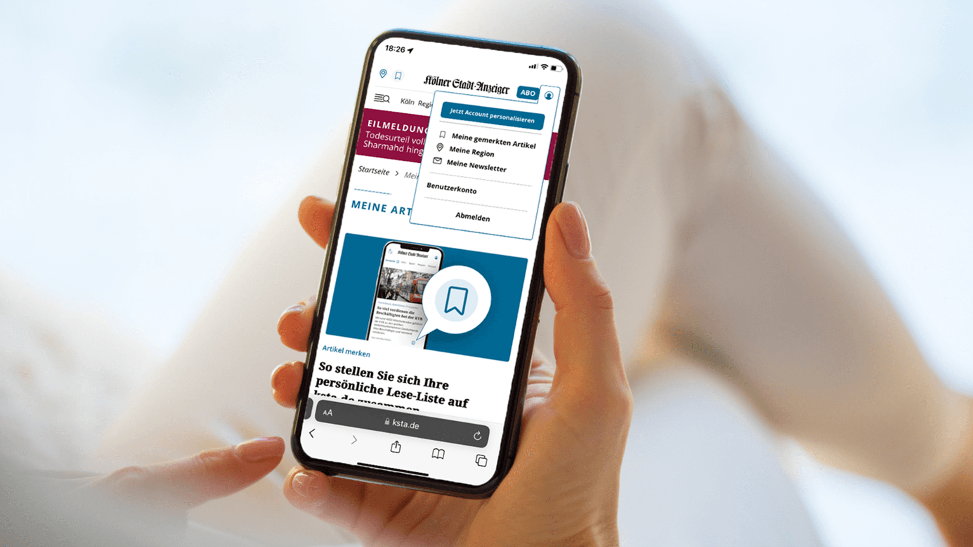 Ein Smartphone-Display zeigt die Bookmark-Funktion auf ksta.de.