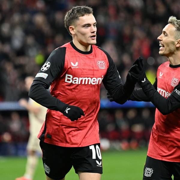 Bayer Leverkusen's German midfielder #10 Florian Wirtz (L) celebrates scoring his team's first goal with Bayer Leverkusen's Spanish defender #20 Alejandro Grimaldo during the UEFA Champions League football match Bayer 04 Leverkusen vs FC Salzburg in Leverkusen, western Germany on November 26, 2024. (Photo by INA FASSBENDER / AFP)