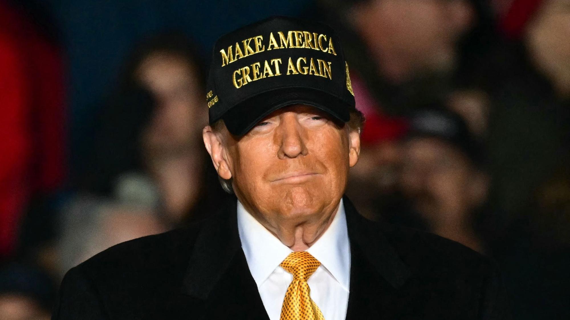 (FILES) Former US President Republican presidential candidate Donald Trump arrives, more than 3 hours late, to a campaign rally in Traverse City, Michigan on October 25, 2024. Donald Trump's victory in the US presidential election, the continuing war in the Middle East or the Paris Olympics... are among the twelve events that marked the year 2024. (Photo by Jim WATSON / AFP)