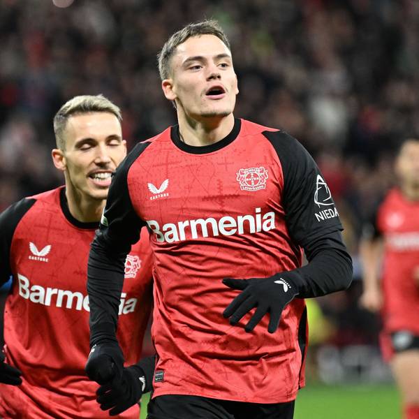 Bayer Leverkusen's German midfielder #10 Florian Wirtz (R) celebrates scoring his team's first goal with Bayer Leverkusen's Spanish defender #20 Alejandro Grimaldo during the UEFA Champions League football match Bayer 04 Leverkusen vs FC Salzburg in Leverkusen, western Germany on November 26, 2024. (Photo by INA FASSBENDER / AFP)