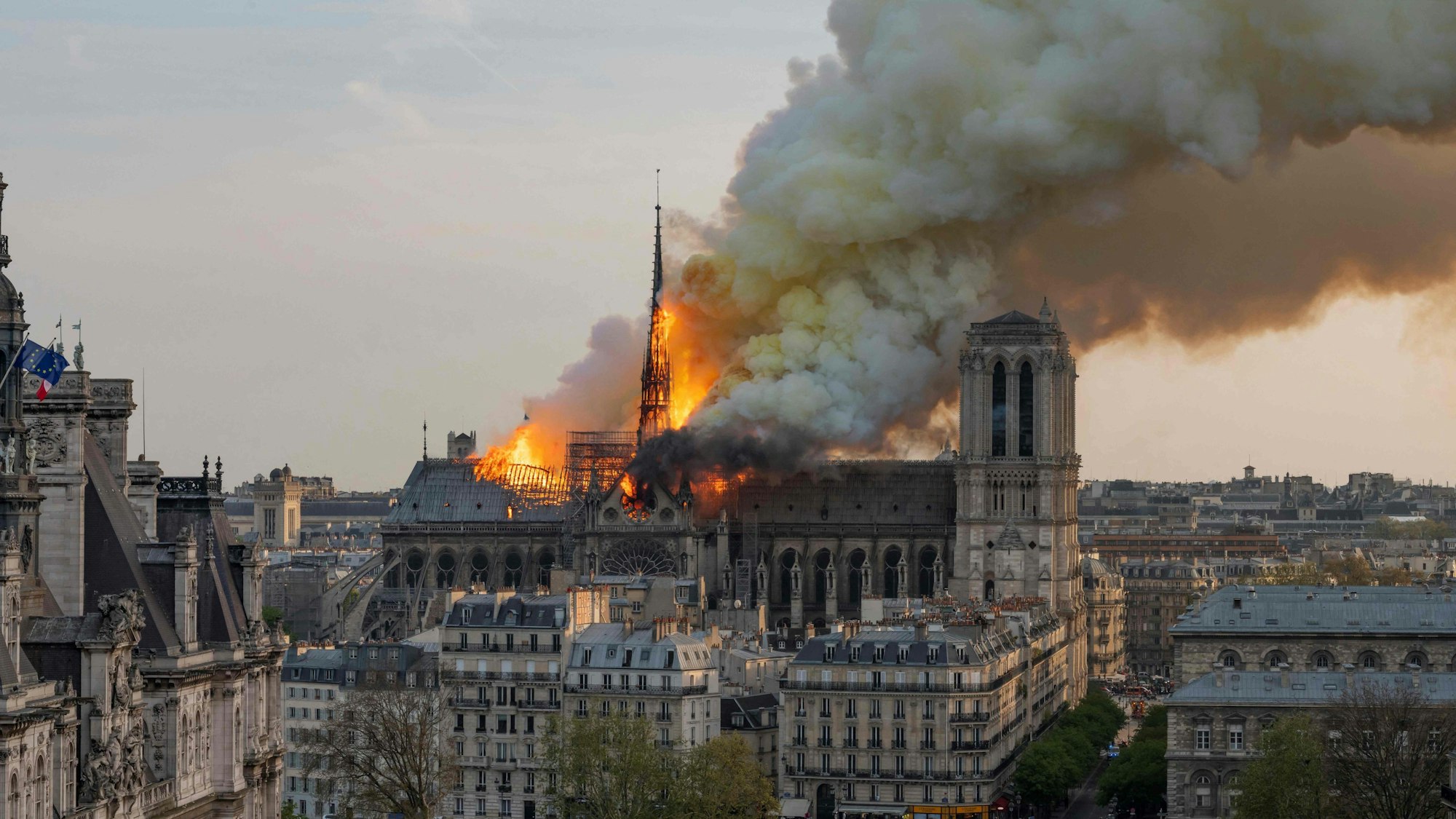 (FILES) Smoke billows as flames burn through the roof of the Notre-Dame de Paris Cathedral on April 15, 2019, in the French capital Paris.