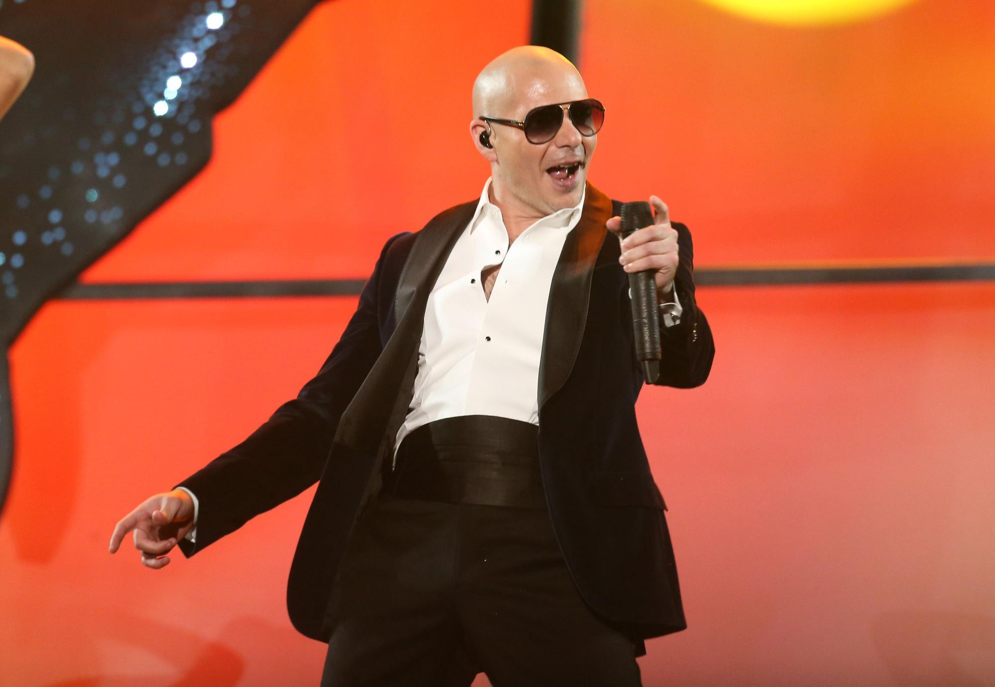 Pitbull performs at the 42nd annual American Music Awards at Nokia Theatre L.A. Live on Sunday, Nov. 23, 2014, in Los Angeles. (Photo by Matt Sayles/Invision/AP)