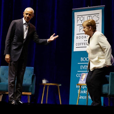 WASHINGTON, DC - DECEMBER 02: Former U.S. President Barack Obama introduces former German Chancellor Angela Merkel as they participate in a book talk at The Anthem on December 02, 2024 in Washington, DC. Obama and Merkel discussed her memoir "Freedom" as well as world politics and the history the leaders have witnessed. Kevin Dietsch/Getty Images/AFP (Photo by Kevin Dietsch / GETTY IMAGES NORTH AMERICA / Getty Images via AFP)