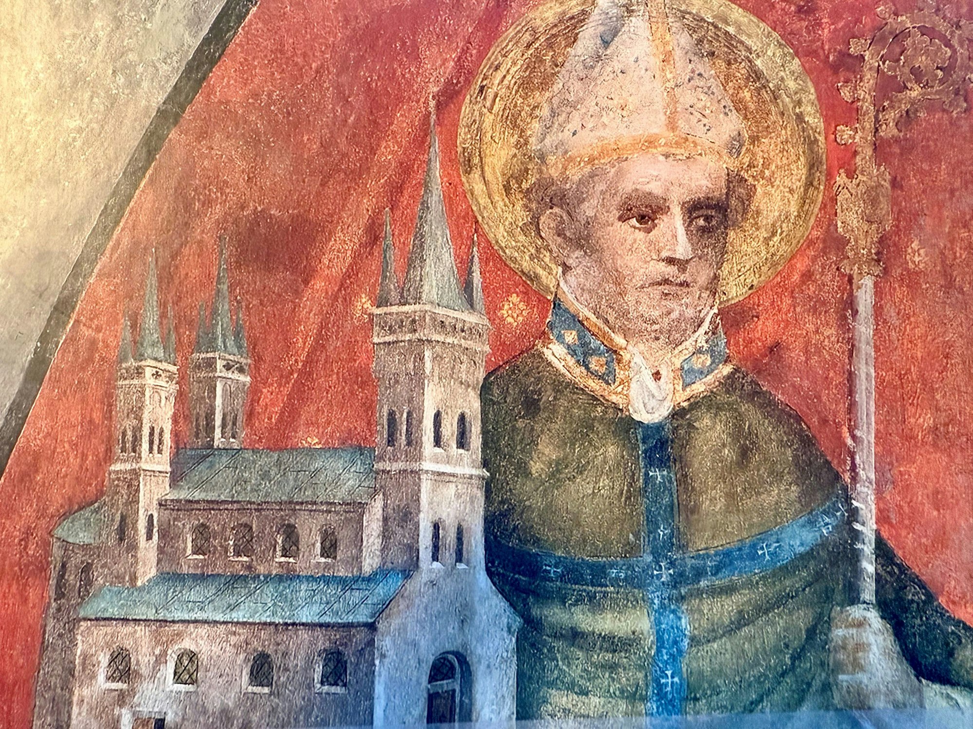 Eine Wandmalerei in der Kirche St. Severin zeigt Kölns Schutzheiligen und die nach ihm benannte romanische Kirche im Süden der Innenstadt.