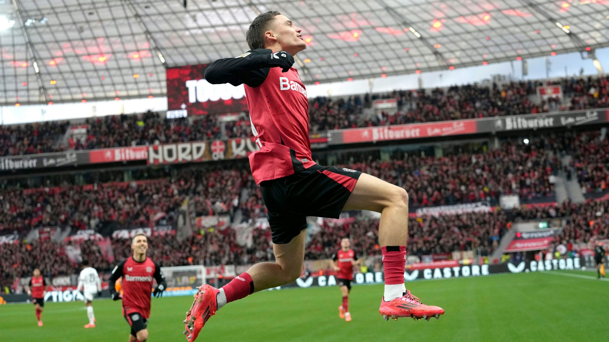 Leverkusen's Florian Wirtz, celebrates after scoring the first goal during the German Bundesliga soccer match between Bayer Leverkusen and St. Pauli at the BayArena in Leverkusen, Germany, Saturday, Dec. 7, 2024. (AP Photo/Martin Meissner)