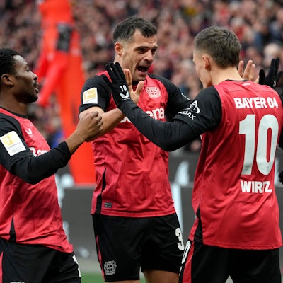 Leverkusen's Florian Wirtz, center right, celebrates with his teammates after scoring the first goal during the German Bundesliga soccer match between Bayer Leverkusen and St. Pauli at the BayArena in Leverkusen, Germany, Saturday, Dec. 7, 2024. (AP Photo/Martin Meissner)