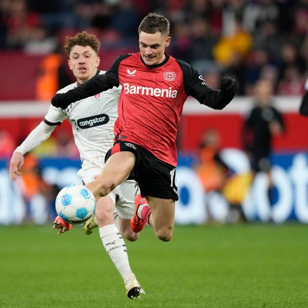 Leverkusen's Florian Wirtz, right, controls the ball by St. Pauli's Philipp Treu during the German Bundesliga soccer match between Bayer Leverkusen and St. Pauli at the BayArena in Leverkusen, Germany, Saturday, Dec. 7, 2024. (AP Photo/Martin Meissner)