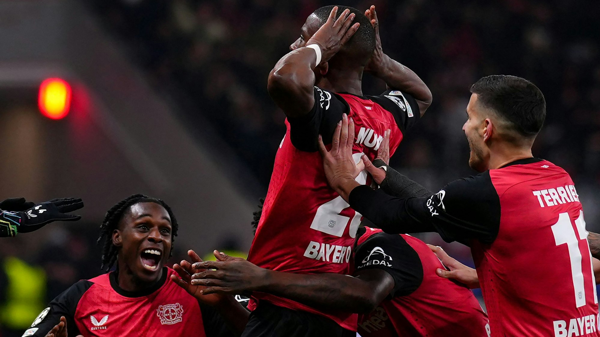 Bayer Leverkusen's French forward #23 Nordi Mukiele (C) celebrates scoring the first goal during the UEFA Champions League football match between Bayer 04 Leverkusen and Inter Milan in Leverkusen, western Germany on December 10, 2024. (Photo by Pau BARRENA / AFP)