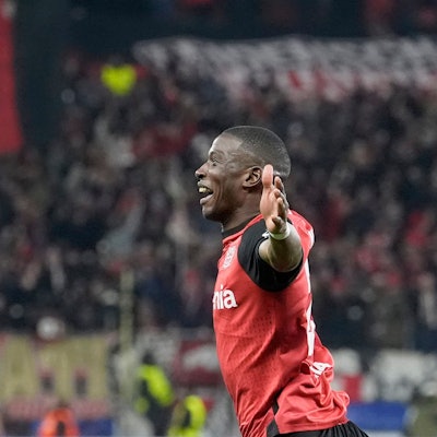 Leverkusen's Nordi Mukiele celebrates after scoring the opening goal during the Champions League opening phase soccer match between Bayer Leverkusen and Inter Milan at the BayArena in Leverkusen, Germany, Tuesday Dec. 10, 2024. (AP Photo/Martin Meissner)