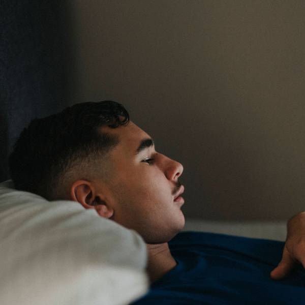 Teenage boy using mobile phone while lying in bedroom at home Sweden, Gothenburg, model released, property released Copyright: xMaskotx , MA106908 MA106908