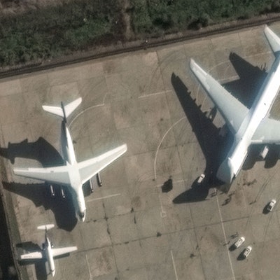 This handout satellite image released by Maxar Technologies on December 13, 2024 shows an Antonov An-124 heavy transport aircraft preparing to load equipment at the Russian Hmeimim Air Base in Syria's western province of Latakia. Islamist-led rebels took the Syrian capital Damascus in a lightning offensive on December 8, ousting president Bashar al-Assad and ending five decades of Baath rule in the country. Assad was propped up by Russia, where he reportedly fled, as well as Iran and Lebanon's Hezbollah militant group. (Photo by Satellite image ©2024 Maxar Technologies / AFP) / RESTRICTED TO EDITORIAL USE - MANDATORY CREDIT "AFP PHOTO / SATELLITE IMAGE ©2024 MAXAR TECHNOLOGIES" - NO MARKETING NO ADVERTISING CAMPAIGNS - DISTRIBUTED AS A SERVICE TO CLIENTS