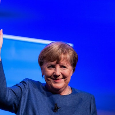 German former Chancellor Angela Merkel reacts on stage during the presentation of her book "Freedom: Memories 1954 - 2021" ("Freiheit") at Flora palace in Cologne on December 16, 2024. (Photo by Rolf Vennenbernd / POOL / AFP)