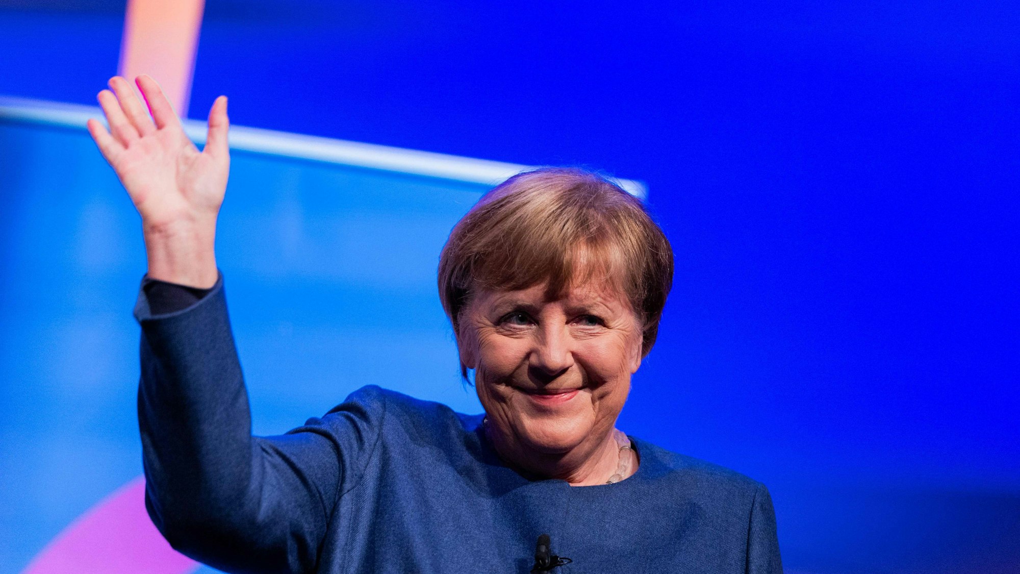 German former Chancellor Angela Merkel reacts on stage during the presentation of her book "Freedom: Memories 1954 - 2021" ("Freiheit") at Flora palace in Cologne on December 16, 2024. (Photo by Rolf Vennenbernd / POOL / AFP)