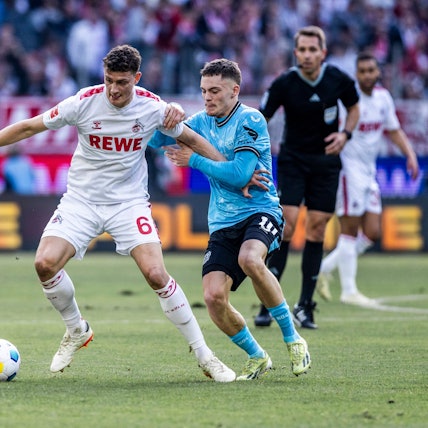 Kölns Eric Martel (l.) gegen Leverkusens Florian Wirtz: Das letzte Duell der Rhein-Rivalen stieg im März 2024