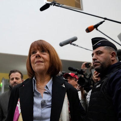 Gisele Pelicot, who was allegedly drugged by her now former husband so that he and others could assault her, arrives at the court house in Avignon, southern France, Thursday, Dec. 19, 2024. (AP Photo/Lewis Joly)