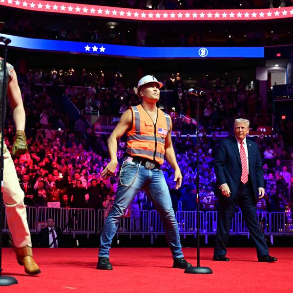 US President-elect Donald Trump looks on as the Village People perform at a MAGA victory rally at Capital One Arena in Washington, DC, on January 19, 2025, one day ahead of his inauguration ceremony. (Photo by Jim WATSON / AFP)