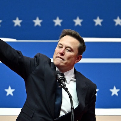 Tesla and SpaceX CEO Elon Musk gestures as he speaks during the inaugural parade inside Capitol One Arena, in Washington, DC, on January 20, 2025. (Photo by ANGELA WEISS / AFP)