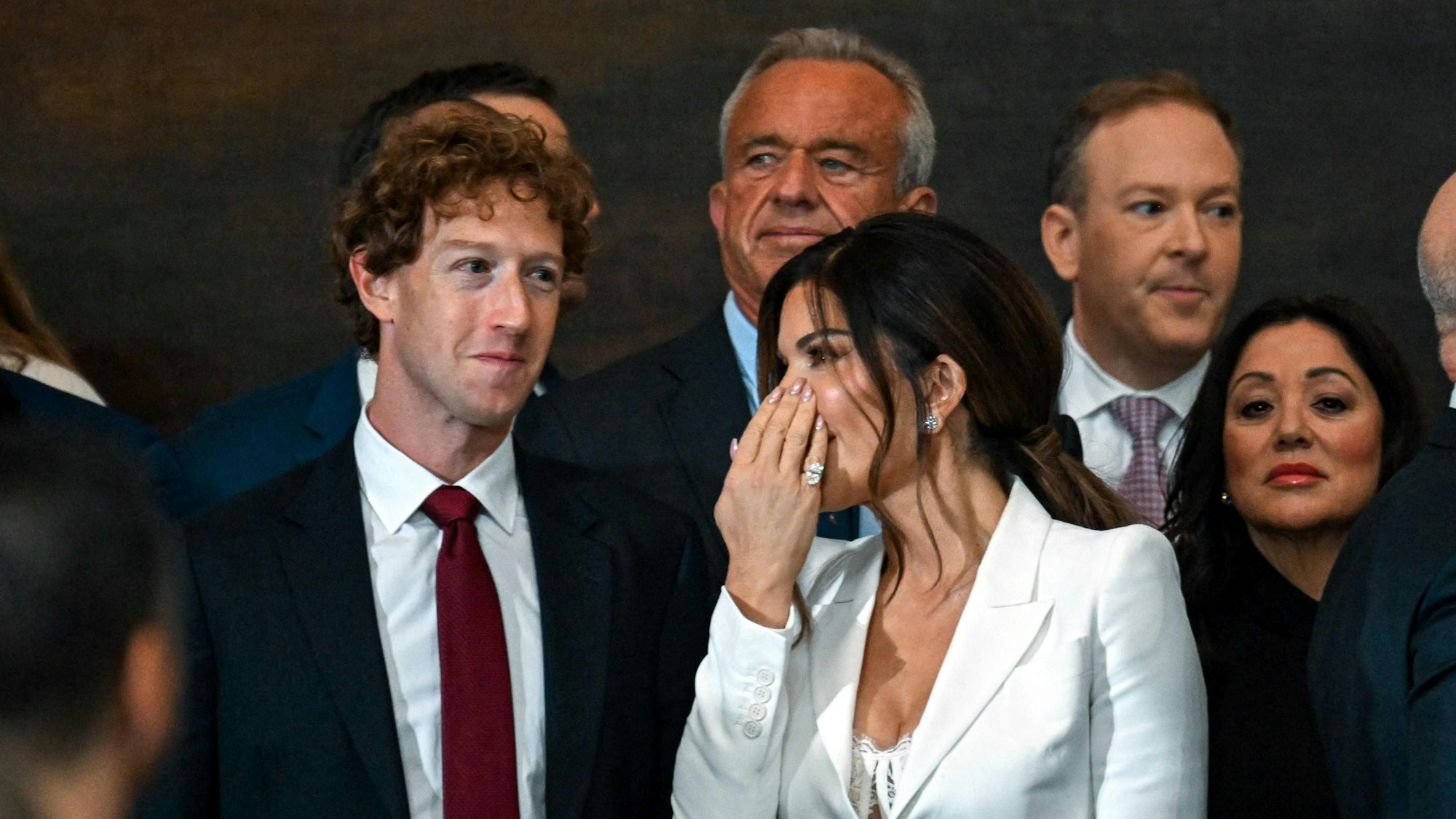Mark Zuckerberg (L), chief executive of Meta, speaks with Amazon founder and owner of The Washington Post Jeff Bezos's partner Lauren Sanchez as Bezos (R) and Health Secretary nominee Robert Kennedy JR. (2nd L), before the inauguration of Donald Trump as the 47th president of the United States inside the Capitol Rotunda of the US Capitol building in Washington, DC, on January 20, 2025. Trump takes office for his second non-consecutive term as the 47th president of the United States. (Photo by Kenny HOLSTON / POOL / AFP)