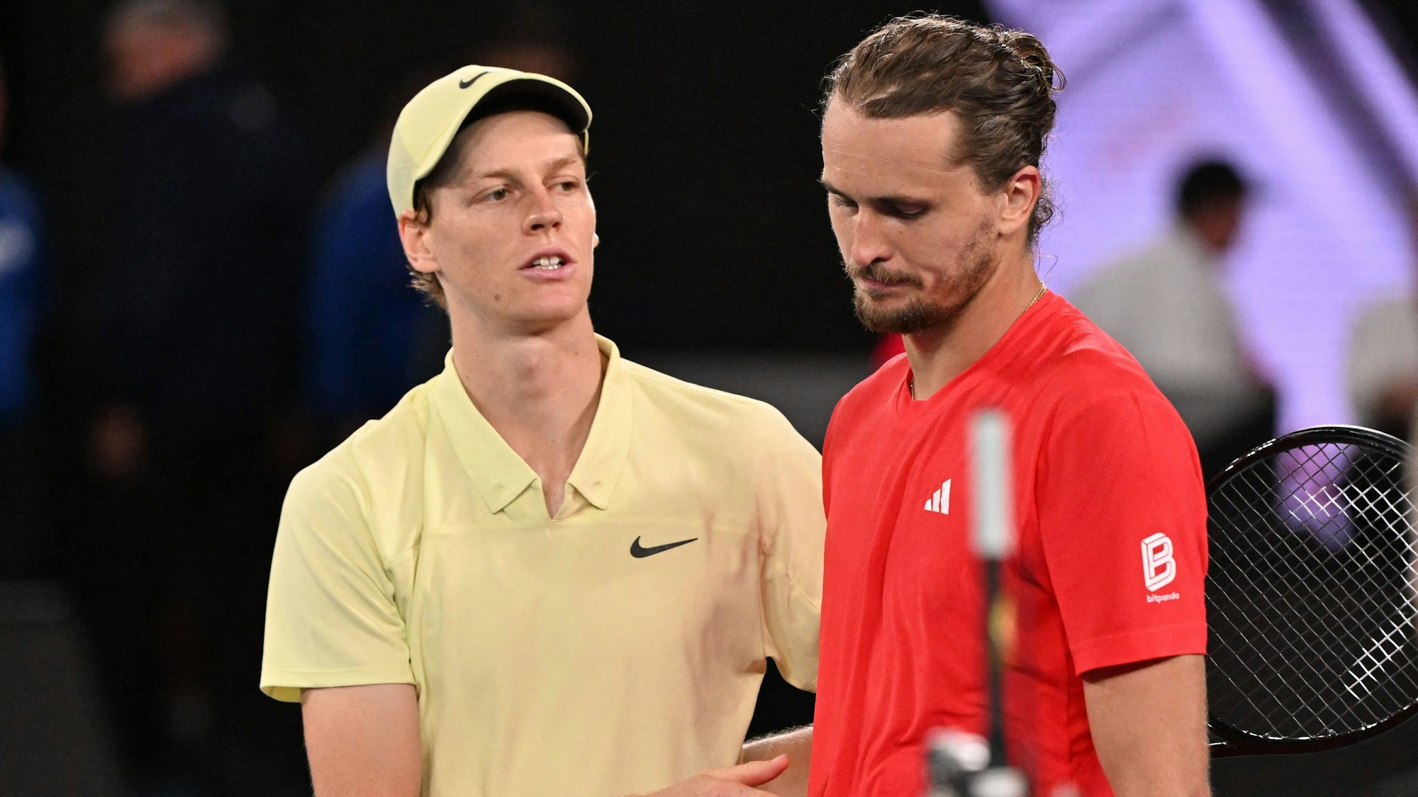 Italy's Jannik Sinner greets Germany's Alexander Zverev after his victory in their men's singles final match on day fifteen of the Australian Open tennis tournament in Melbourne on January 26, 2025. (Photo by WILLIAM WEST / AFP) / -- IMAGE RESTRICTED TO EDITORIAL USE - STRICTLY NO COMMERCIAL USE --