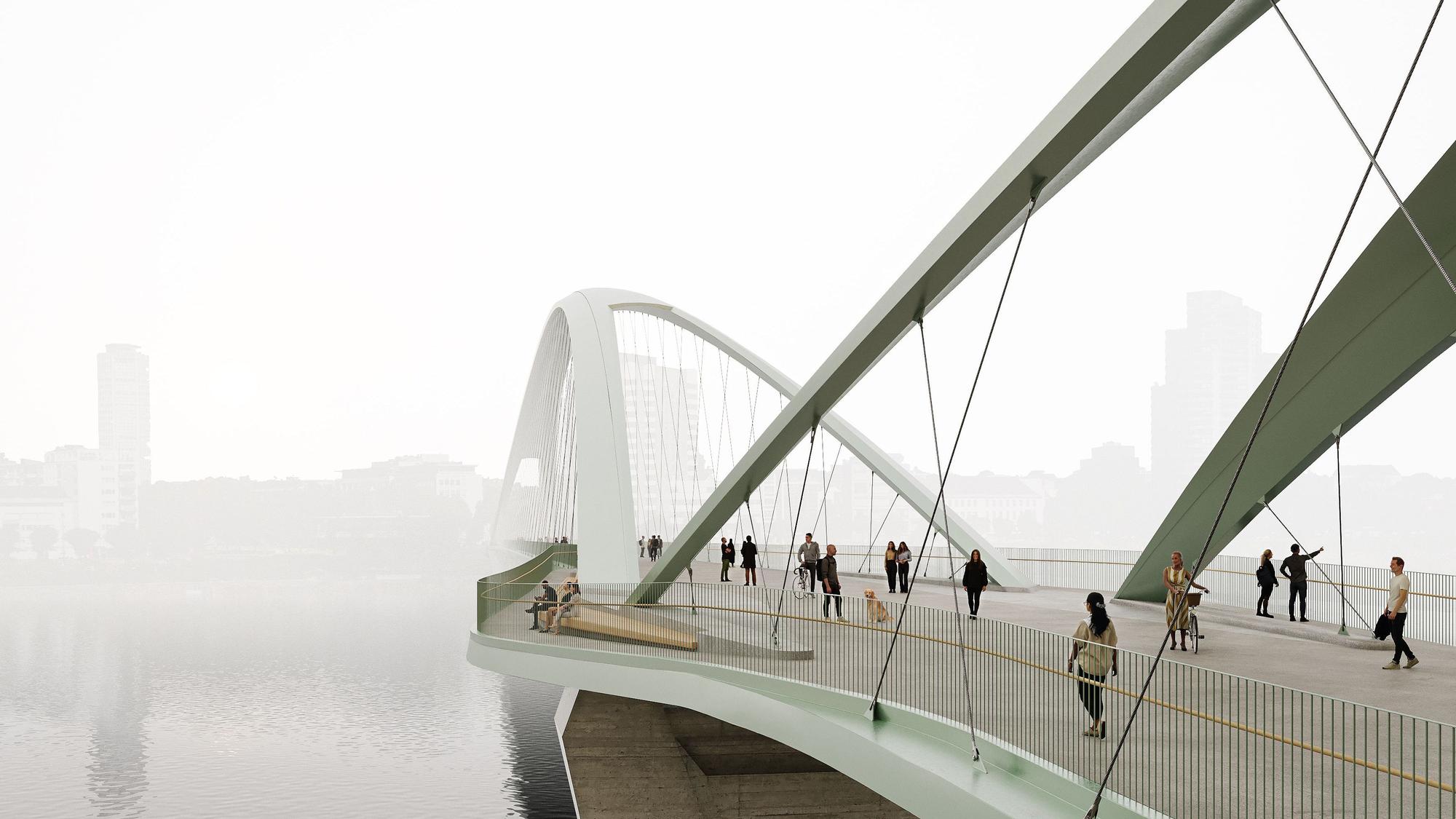 Visualisierung Rad- und Gehwegbrücken über den Rhein in Köln. Höhe Bastei. Der Siegerentwurf für die nördliche Brücke auf Höhe der Bastei sieht eine schlanke Netzwerkbogenbrücke mit zwei Bögen vor. Breite Rampen führen vom Theodor-Heuss-Ring und Rheinpark auf die Brücke hinauf. Die minimalistischen, schlanken Stahlstützen der Brücke nehmen damit das Design der Pavillonarchitektur des Rheinparks auf und beeinträchtigen das Gesamtbild des denkmalgeschützten Parks nicht.