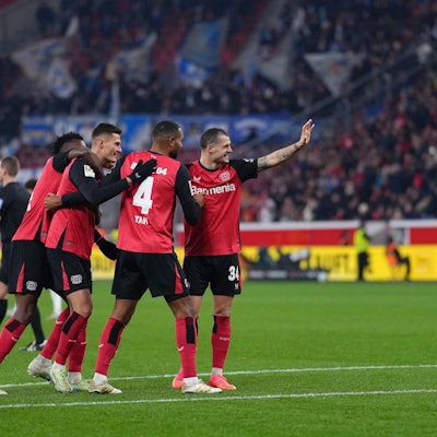 Bayer Leverkusen's Czech forward #14 Patrik Schick (3rd L) is celebrated by team mates after scoring the 3-0 goal during the German first division Bundesliga football match Bayer 04 Leverkusen v TSG 1899 Hoffenheim in Leverkusen, western Germany on February 2, 2025. (Photo by Pau BARRENA / AFP) / DFL REGULATIONS PROHIBIT ANY USE OF PHOTOGRAPHS AS IMAGE SEQUENCES AND/OR QUASI-VIDEO