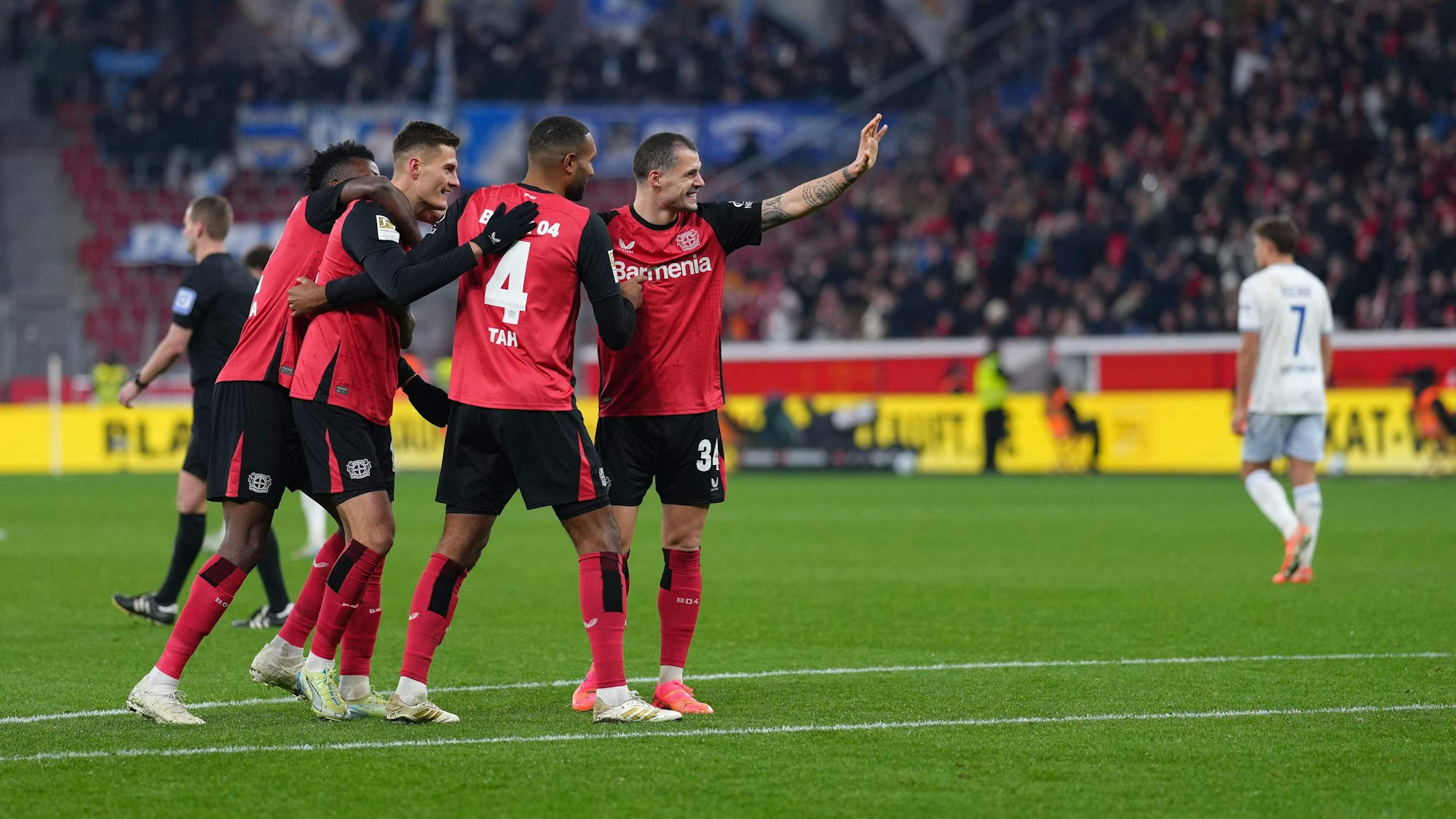 Bayer Leverkusen's Czech forward #14 Patrik Schick (3rd L) is celebrated by team mates after scoring the 3-0 goal during the German first division Bundesliga football match Bayer 04 Leverkusen v TSG 1899 Hoffenheim in Leverkusen, western Germany on February 2, 2025. (Photo by Pau BARRENA / AFP) / DFL REGULATIONS PROHIBIT ANY USE OF PHOTOGRAPHS AS IMAGE SEQUENCES AND/OR QUASI-VIDEO