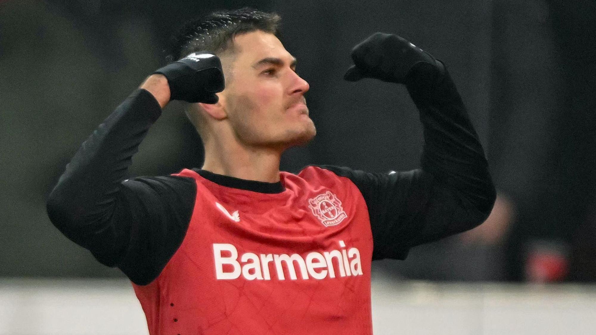 Bayer Leverkusen's Czech forward #14 Patrik Schick celebrates scoring the 2-2 goal during the German Cup (DFB Pokal) quarter-final football match Bayer 04 Leverkusen vs FC Cologne in Leverkusen, western Germany on February 5, 2025. (Photo by INA FASSBENDER / AFP) / DFL REGULATIONS PROHIBIT ANY USE OF PHOTOGRAPHS AS IMAGE SEQUENCES AND/OR QUASI-VIDEO ALTERNATIVE CROP