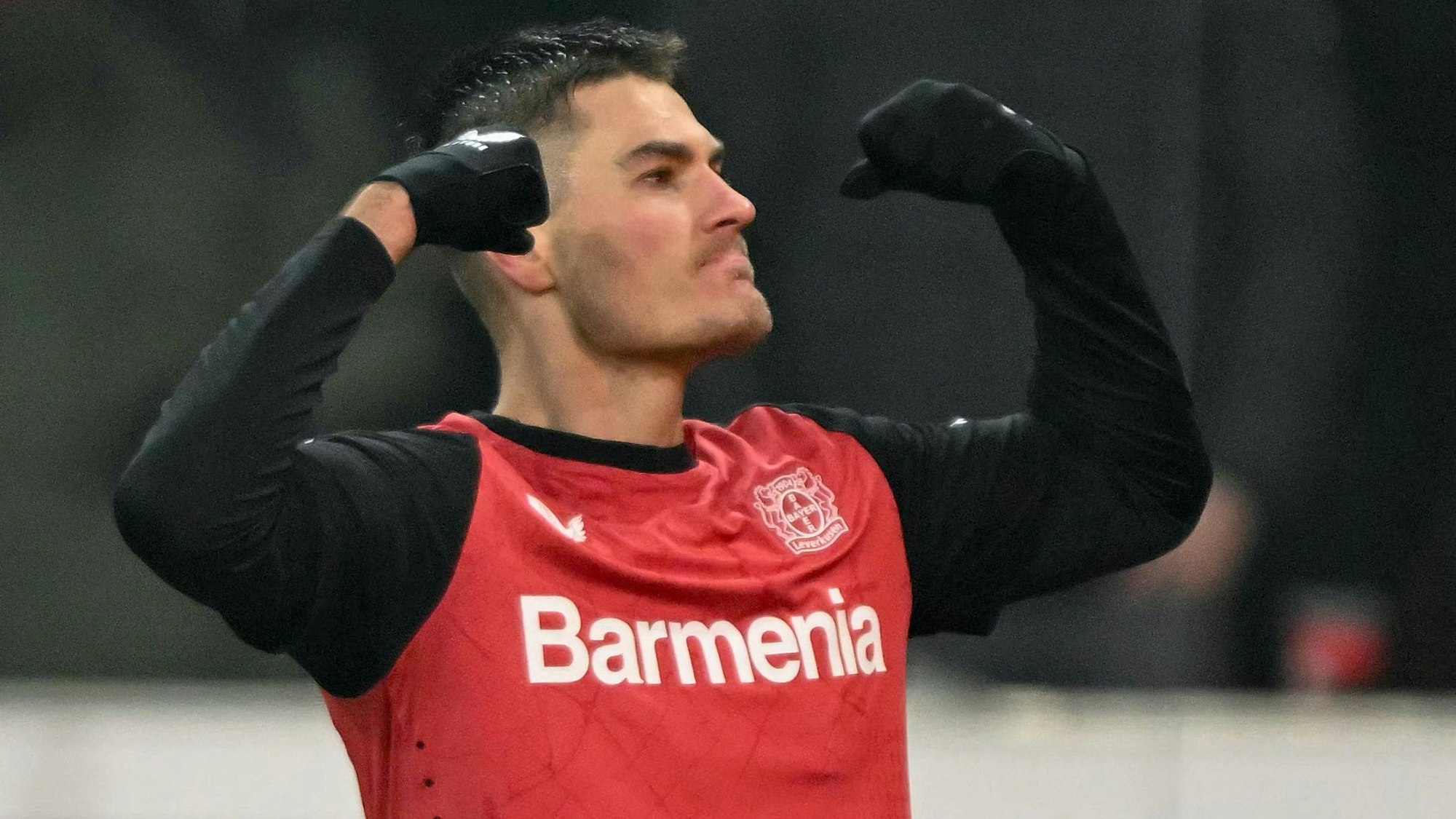 Bayer Leverkusen's Czech forward #14 Patrik Schick celebrates scoring the 2-2 goal during the German Cup (DFB Pokal) quarter-final football match Bayer 04 Leverkusen vs FC Cologne in Leverkusen, western Germany on February 5, 2025. (Photo by INA FASSBENDER / AFP) / DFL REGULATIONS PROHIBIT ANY USE OF PHOTOGRAPHS AS IMAGE SEQUENCES AND/OR QUASI-VIDEO ALTERNATIVE CROP
