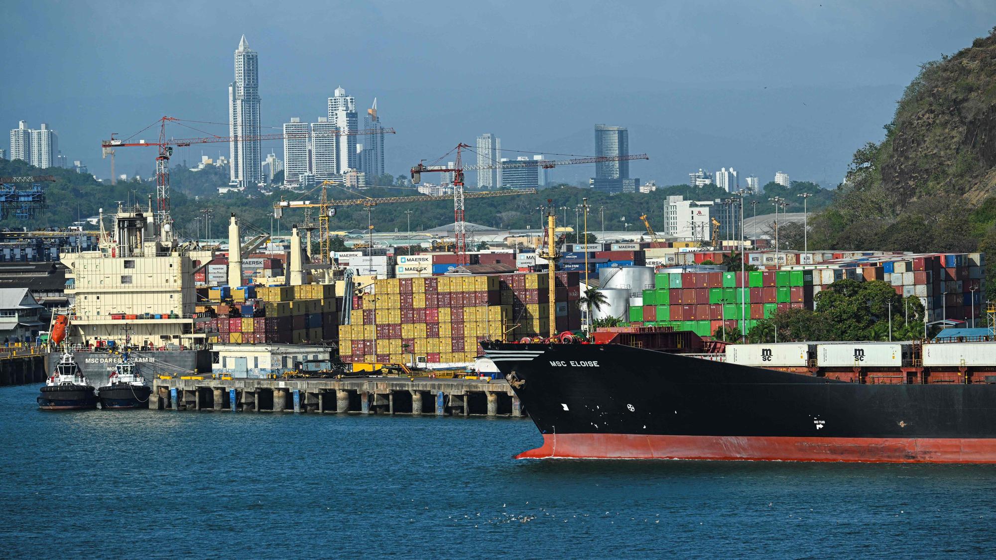 A cargo ship waits at Balboa port before crossing the Panama Canal in Panama City on February 4,2025. Two Panamanian lawyers filed a complaint Monday to cancel the concession of a Hong Kong-based company for operating two ports on the Panama Canal, following US President Donald Trump's threats to seize the vital waterway. (Photo by Martin BERNETTI / AFP)