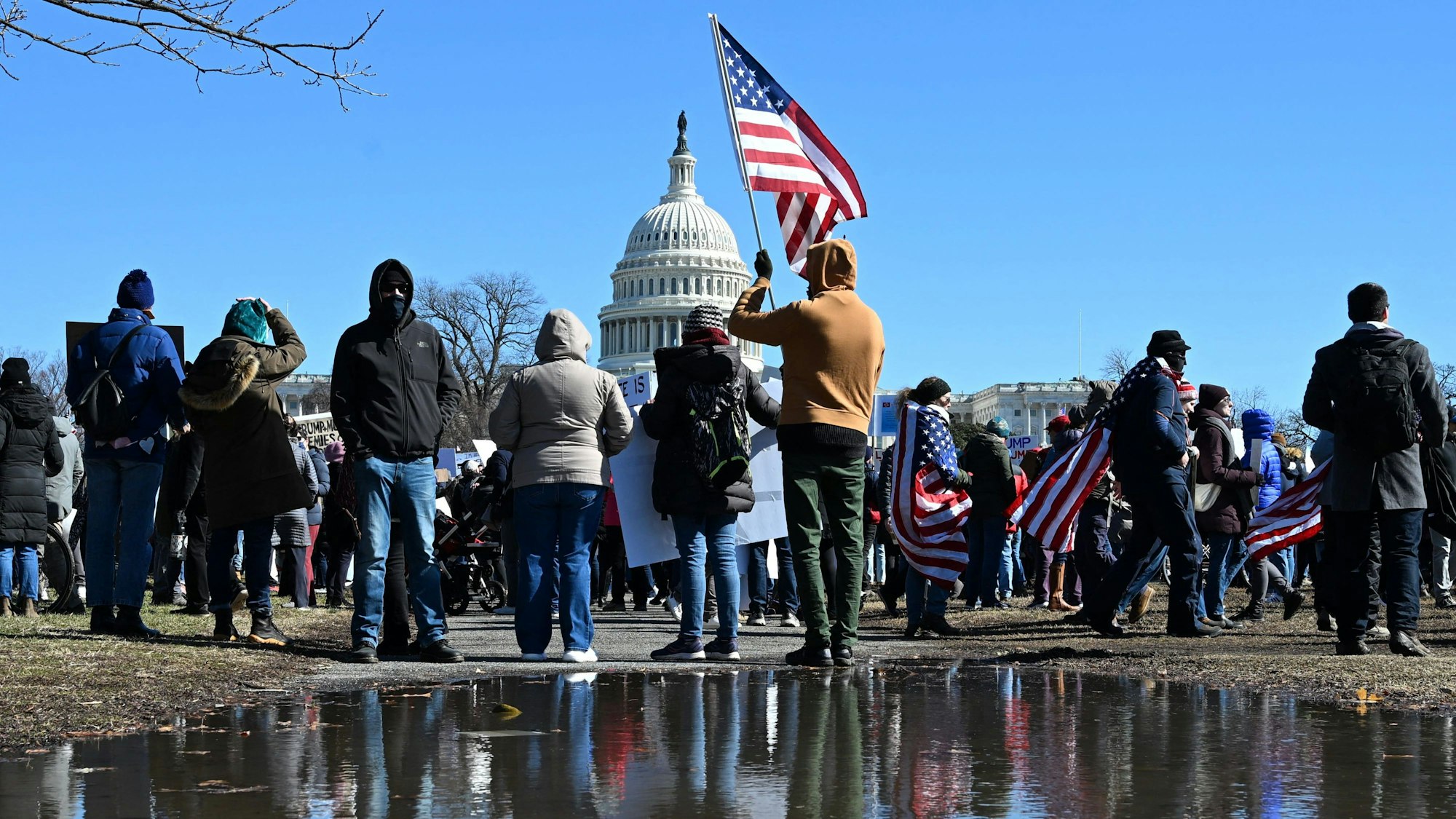 TOPSHOT - Demonstrators rally against US President Donald Trump and his policies during a protest near the US Capitol marking Presidents Day on February 17, 2025 in Washington, DC. (Photo by Alex Wroblewski / AFP)