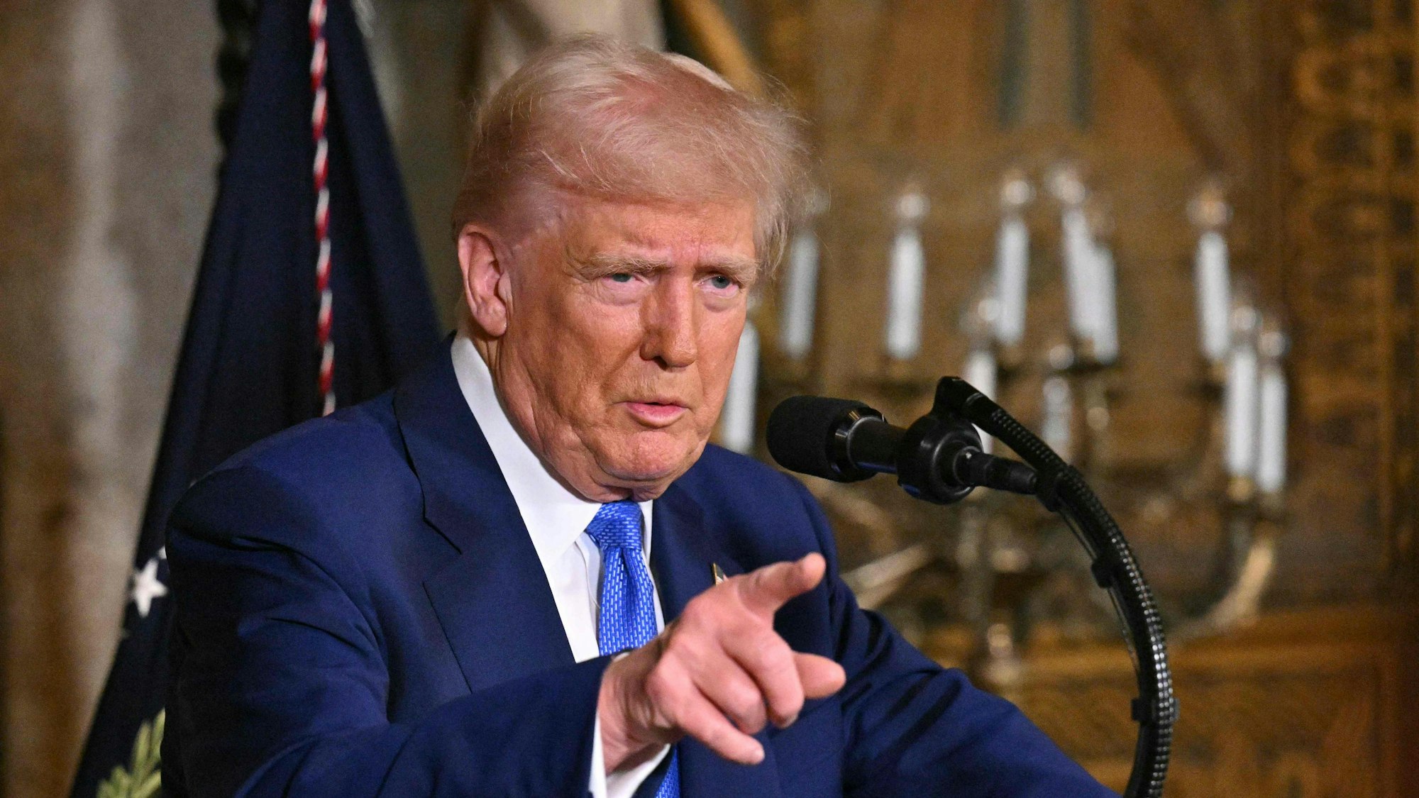 TOPSHOT - US President Donald Trump speaks during signing of executive orders at his Mar-a-Lago resort in Palm Beach, Florida, on February 18, 2025. (Photo by ROBERTO SCHMIDT / AFP)