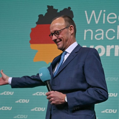Friedrich Merz, leader of Germany's conservative Christian Democratic Union (CDU) and his party's main candidate for Chancellor addresses supporters after the first exit polls in the German general elections were announced on TV during the electoral evening in Berlin on February 23, 2025. (Photo by INA FASSBENDER / AFP)