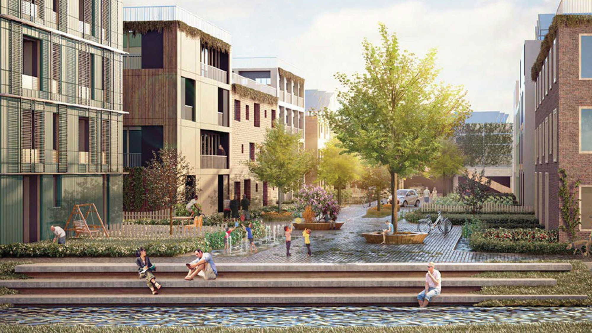 Menschen sitzen auf Stufen an einer Wasserfläche, dahinter moderne Wohnhäuser.