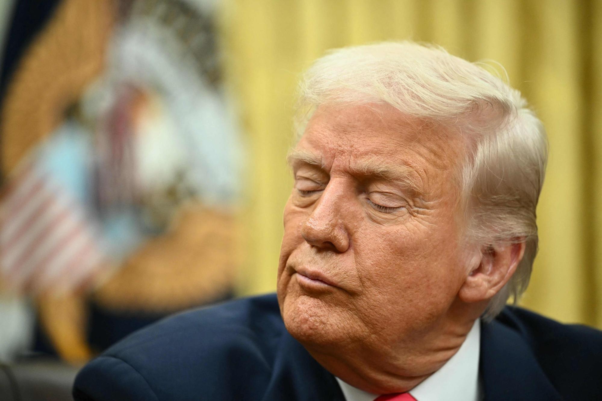 TOPSHOT - US President Donald Trump speaks after signing executive orders in the Oval Office of the White House in Washington, DC on March 6, 2025. (Photo by Mandel NGAN / AFP)