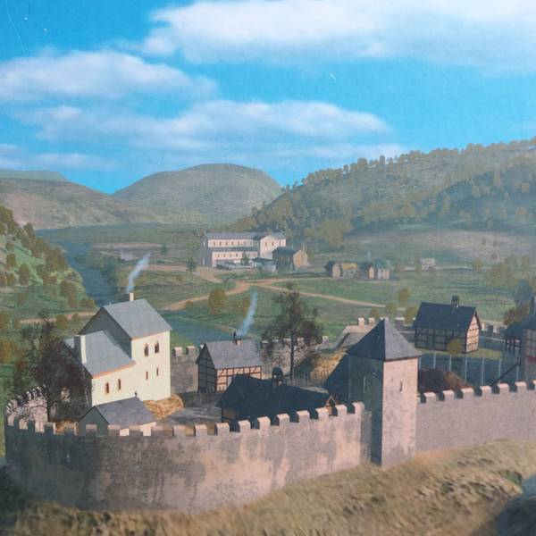 Eine Burg mit Festungsmauer.
