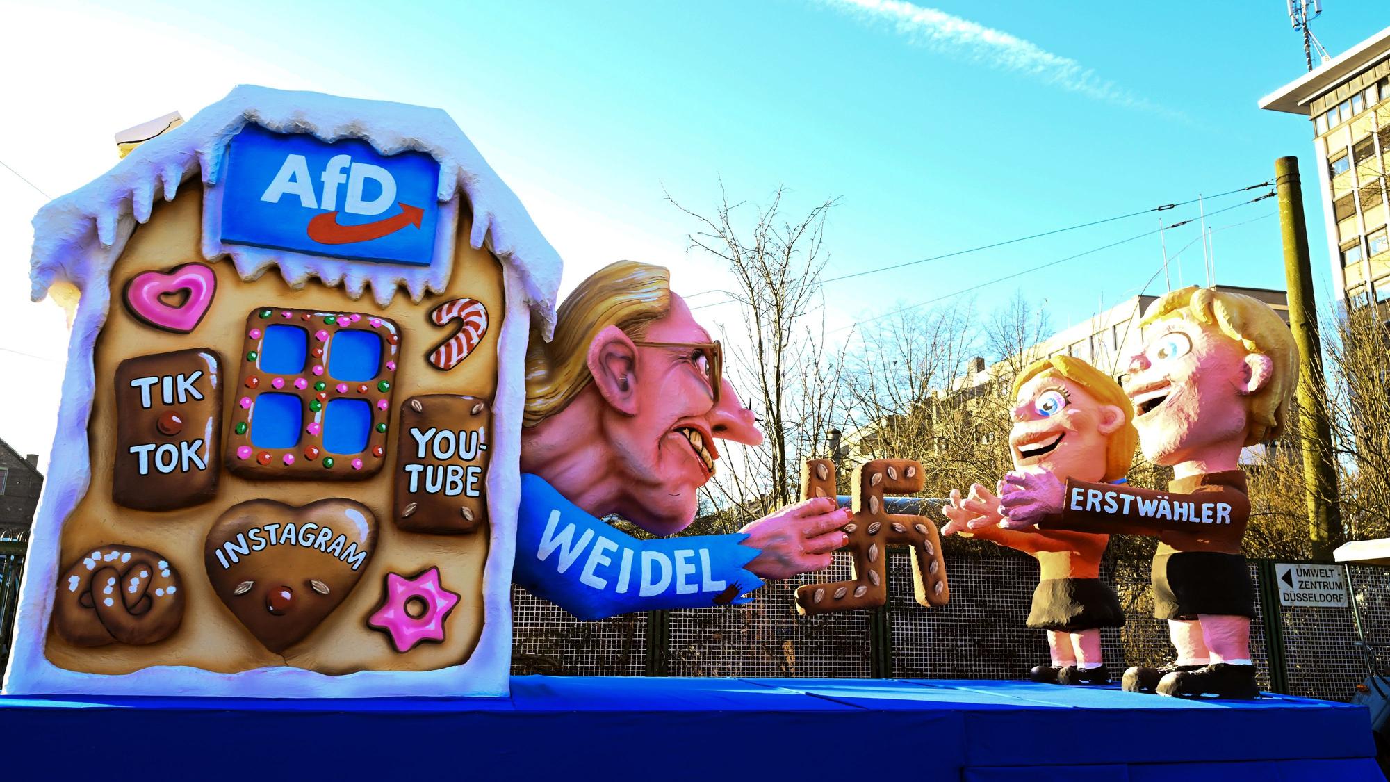 03.03.2025, Nordrhein-Westfalen, Köln: Ein Mottowagen mit einem AfD-Motiv fährt zum Zug. Am Rosenmontag ist Höhepunkt der rheinischen Karnevalssaison mit den traditionellen Zug durch Düsseldorf. Foto: Federico Gambarini/dpa +++ dpa-Bildfunk +++