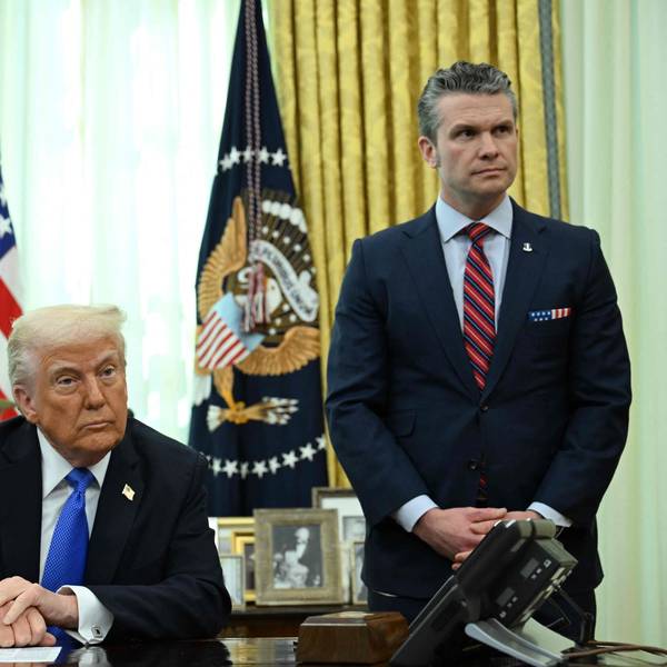 (FILES) US President Donald Trump and Secretary of Defense Pete Hegseth listen during an event in the Oval Office of the White House in Washington, DC, on March 21, 2025. A US journalist was inadvertently included in a group chat in which Defense Secretary Pete Hegseth, Vice President JD Vance and other top officials discussed upcoming strikes against Yemen's Huthi rebels, the White House confirmed on March 24, 2025. (Photo by Annabelle Gordon / AFP)