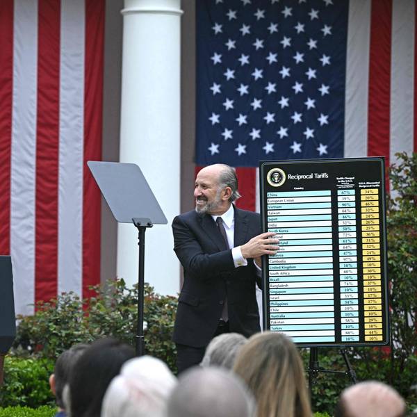US President Donald Trump delivers remarks on reciprocal tariffs as US Secretary of Commerce Howard Lutnick holds a chart during an event in the Rose Garden entitled "Make America Wealthy Again" at the White House in Washington, DC, on April 2, 2025. Trump geared up to unveil sweeping new "Liberation Day" tariffs in a move that threatens to ignite a devastating global trade war. Key US trading partners including the European Union and Britain said they were preparing their responses to Trump's escalation, as nervous markets fell in Europe and America. (Photo by Brendan SMIALOWSKI / AFP)