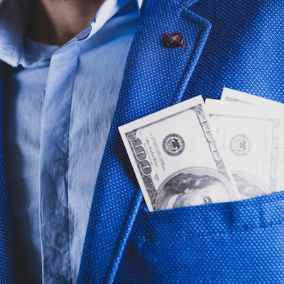 man counts money calculating finance