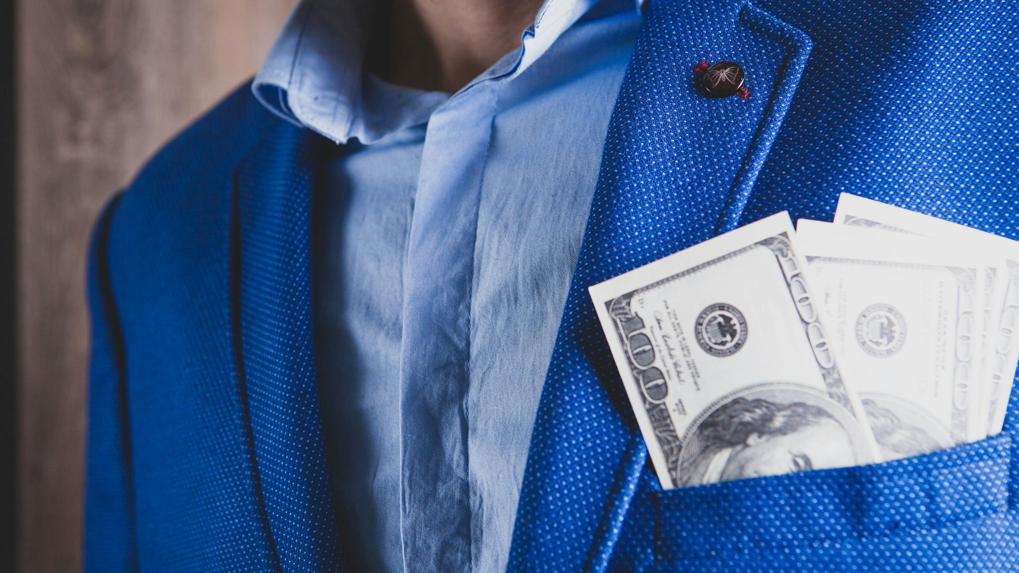 man counts money calculating finance