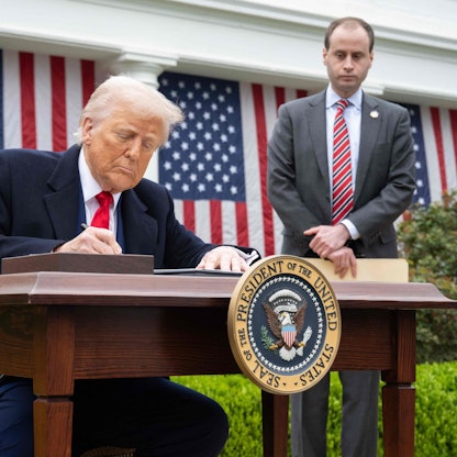 US President Donald Trump signs an executive order after delivering remarks on reciprocal tariffs during an event in the Rose Garden entitled "Make America Wealthy Again" at the White House in Washington, DC, on April 2, 2025. Trump geared up to unveil sweeping new "Liberation Day" tariffs in a move that threatens to ignite a devastating global trade war. Key US trading partners including the European Union and Britain said they were preparing their responses to Trump's escalation, as nervous markets fell in Europe and America. (Photo by SAUL LOEB / AFP)